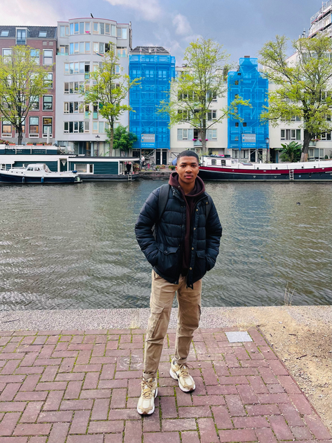 Iviwe standing beside a canal in Amsterdam