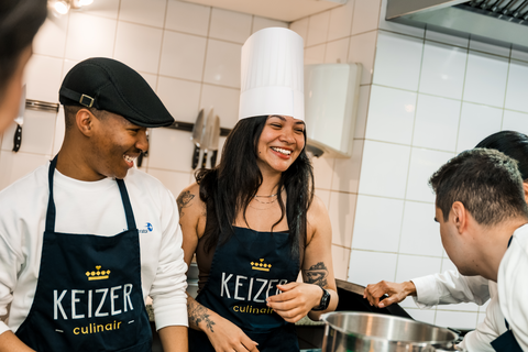 Iviwe and fellow participants smiling during a cooking activity